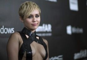  photo 454506-singer-miley-cyrus-poses-at-the-amfars-fifth-annual-inspiration-gala_zps81e7caaa.jpg